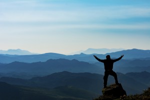 Man on precipice-iStock_000077424493_Medium Exercising and going outdoors with asthma and allergies